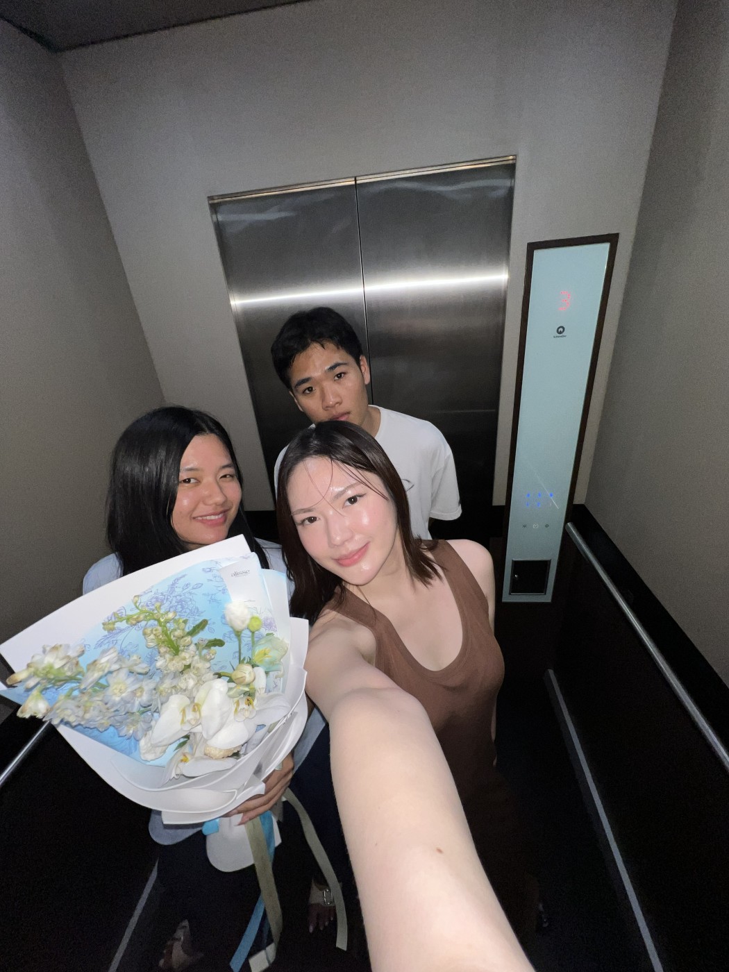 Flowers and friends in the elevator
